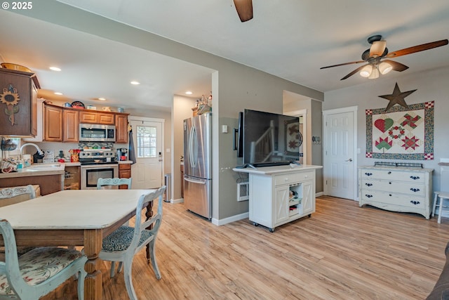 4309 C St, Washougal, WA 98671 - kitchen featuring appliances with stainless steel finishes, a ceiling fan, light wood-type flooring, light countertops, and recessed lighting