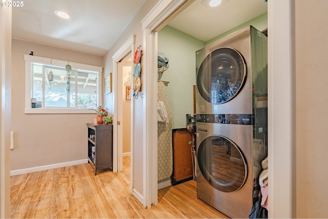 4309 C St, Washougal, WA 98671 - laundry area with stacked washer / dryer, wood finished floors, and baseboards