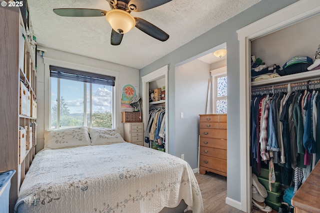4309 C St, Washougal, WA 98671 - bedroom featuring wood finished floors, ceiling fan, baseboards, and a textured ceiling