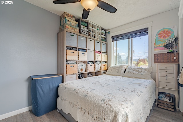 4309 C St, Washougal, WA 98671 - bedroom featuring wood finished floors, baseboards, a ceiling fan, and a textured ceiling