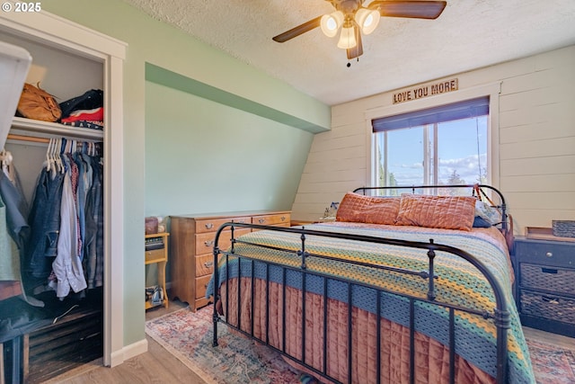 4309 C St, Washougal, WA 98671 - bedroom featuring wood finished floors, a textured ceiling, and wood walls