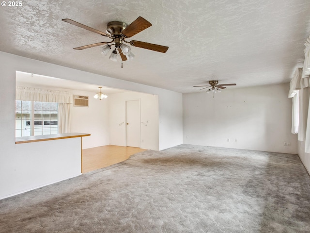 4118 SE 132nd Ave, Portland, OR 97236 - unfurnished living room featuring a ceiling fan, carpet, a chandelier, and a textured ceiling
