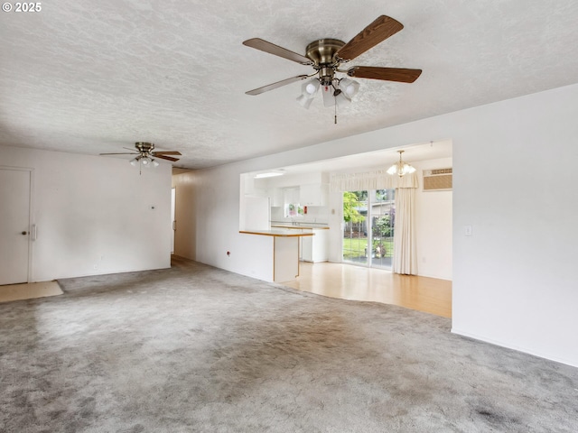 4118 SE 132nd Ave, Portland, OR 97236 - unfurnished living room with ceiling fan, light carpet, a wall unit AC, a textured ceiling, and a chandelier