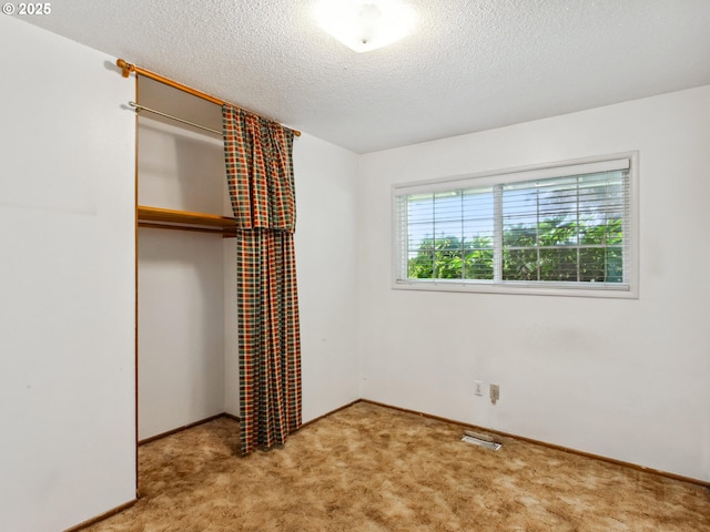 4118 SE 132nd Ave, Portland, OR 97236 - unfurnished bedroom with a closet, carpet, and a textured ceiling