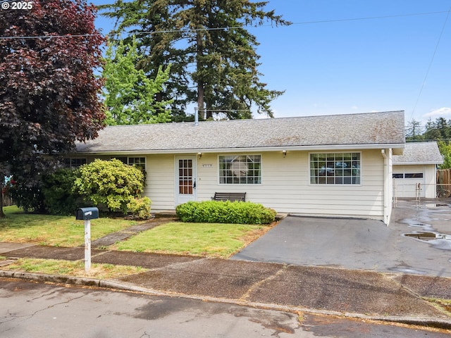 4118 SE 132nd Ave, Portland, OR 97236 - ranch-style home featuring a front yard, a garage, and asphalt driveway