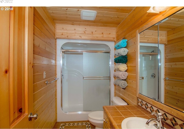 bathroom with rustic walls, wood ceiling, wood walls, and a shower with shower door