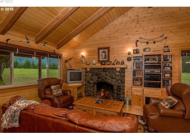 living room with wooden walls, high vaulted ceiling, beam ceiling, wooden ceiling, and a stone fireplace