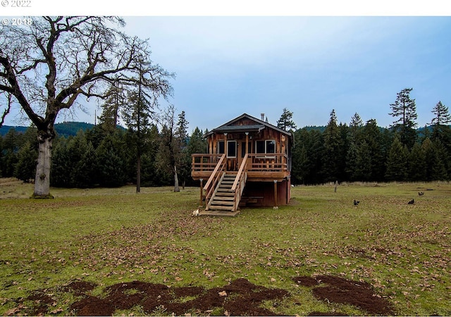 view of jungle gym with a yard and a wooden deck