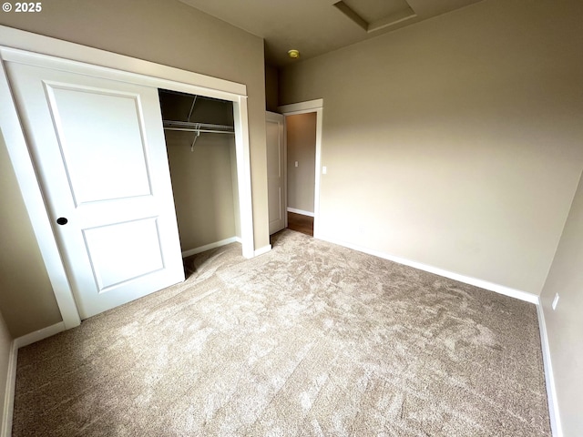 931 Medina Ave, Sutherlin, OR 97479 - unfurnished bedroom with baseboards, carpet flooring, a closet, and attic access