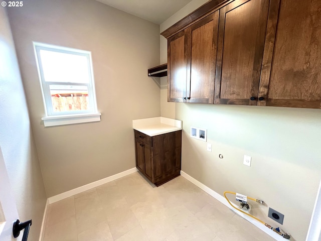 931 Medina Ave, Sutherlin, OR 97479 - laundry area featuring hookup for a washing machine, hookup for an electric dryer, hookup for a gas dryer, baseboards, and cabinet space