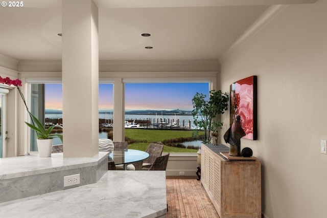 view of patio with outdoor dining space and a water view