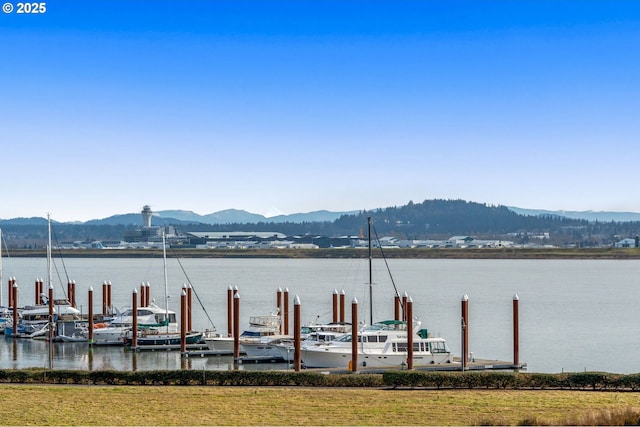 dock area featuring a water and mountain view