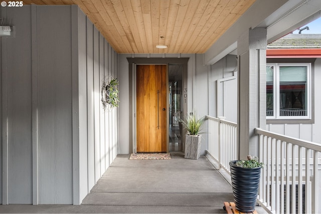 doorway to property with board and batten siding