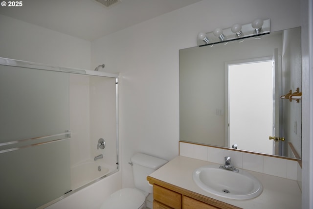 bathroom with vanity, toilet, and shower / washtub combination