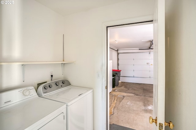 laundry room featuring separate washer and dryer and laundry area