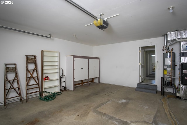 garage featuring gas water heater and a garage door opener