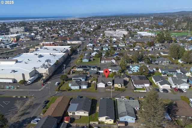 birds eye view of property with a residential view