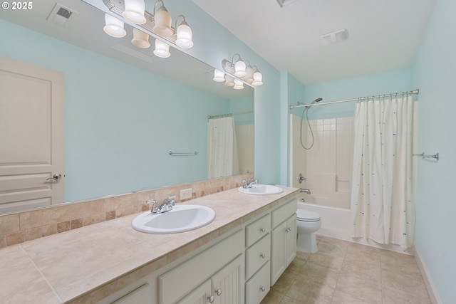 full bath featuring tile patterned floors, visible vents, a sink, and shower / tub combo with curtain