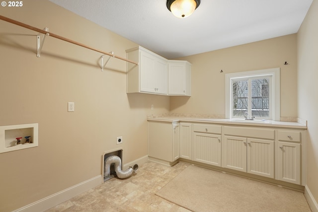 laundry room featuring washer hookup, a sink, baseboards, cabinet space, and electric dryer hookup