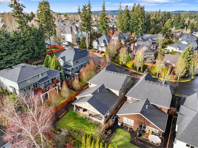 birds eye view of property with a residential view