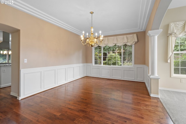 4220 NE 171st Ave, Vancouver, WA 98682 - unfurnished dining area with ornate columns, a chandelier, plenty of natural light, and a wainscoted wall