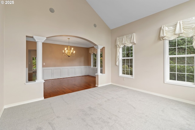 4220 NE 171st Ave, Vancouver, WA 98682 - empty room with carpet, decorative columns, a chandelier, arched walkways, and high vaulted ceiling
