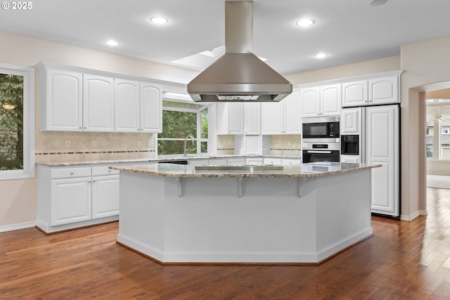 4220 NE 171st Ave, Vancouver, WA 98682 - kitchen featuring island range hood, built in appliances, a center island, light stone countertops, and recessed lighting