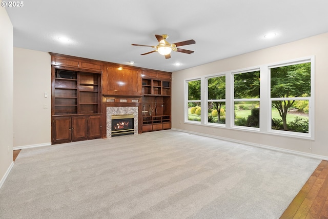 4220 NE 171st Ave, Vancouver, WA 98682 - unfurnished living room featuring ceiling fan, a fireplace, recessed lighting, light carpet, and light wood-style flooring