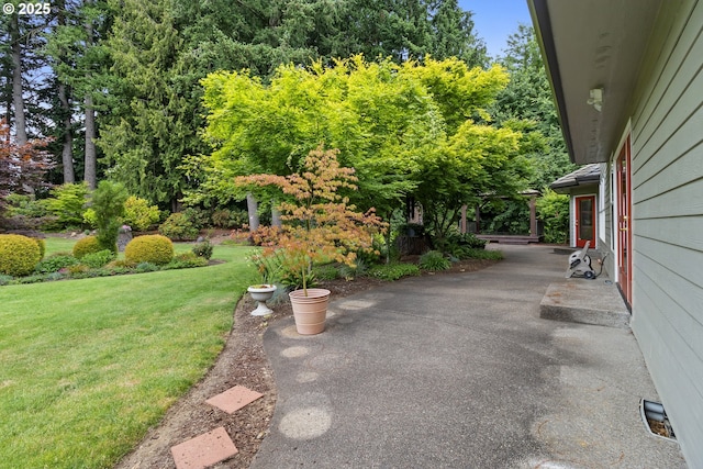 4220 NE 171st Ave, Vancouver, WA 98682 - view of grassy yard featuring a patio area and view of wooded area
