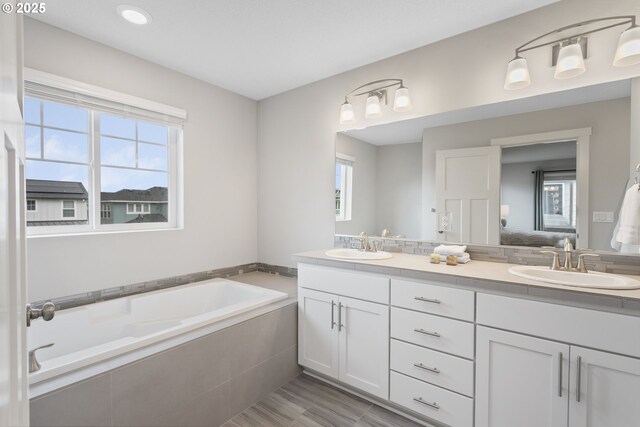 31380 NW Turel Dr, North Plains, OR 97133 - bathroom featuring healthy amount of natural light, double vanity, and a bath