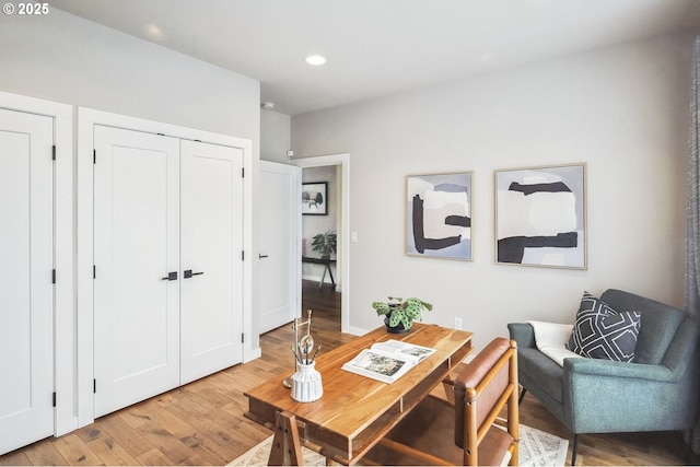 home office with hardwood / wood-style flooring