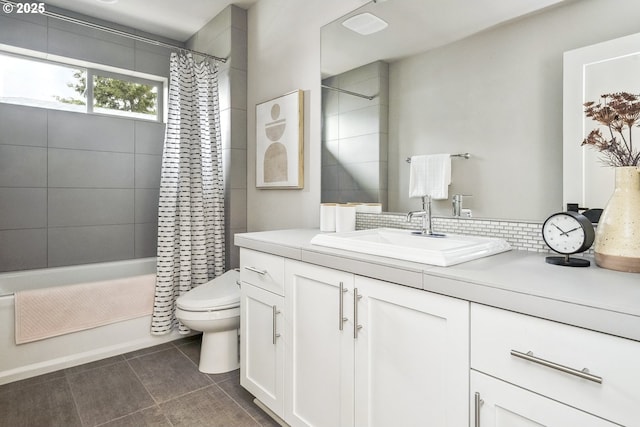 full bathroom with vanity, shower / bath combo, tile patterned floors, and toilet