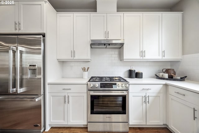 kitchen featuring white cabinetry, appliances with stainless steel finishes, and backsplash