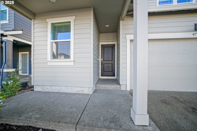 entrance to property featuring a garage