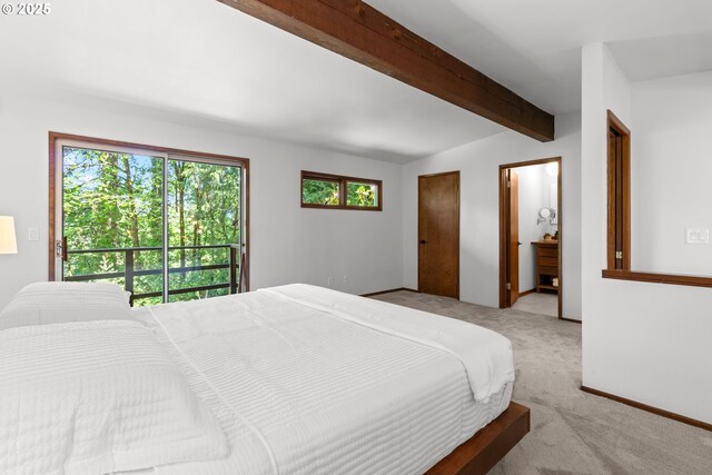 3115 NW Cornell Rd, Portland, OR 97210 - bedroom with beamed ceiling, carpet floors, and baseboards