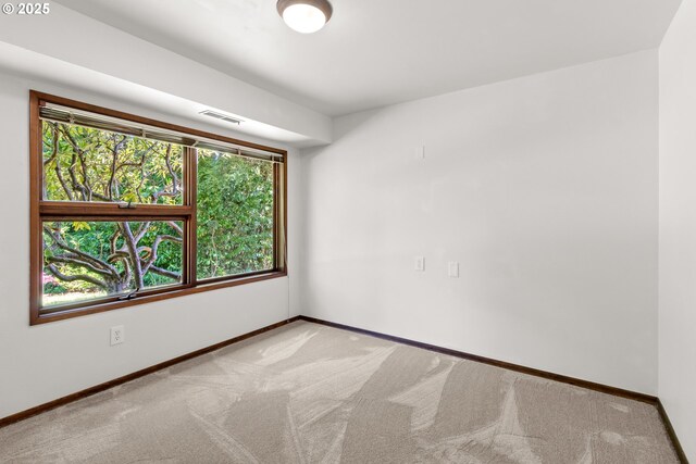 3115 NW Cornell Rd, Portland, OR 97210 - spare room with baseboards and carpet floors