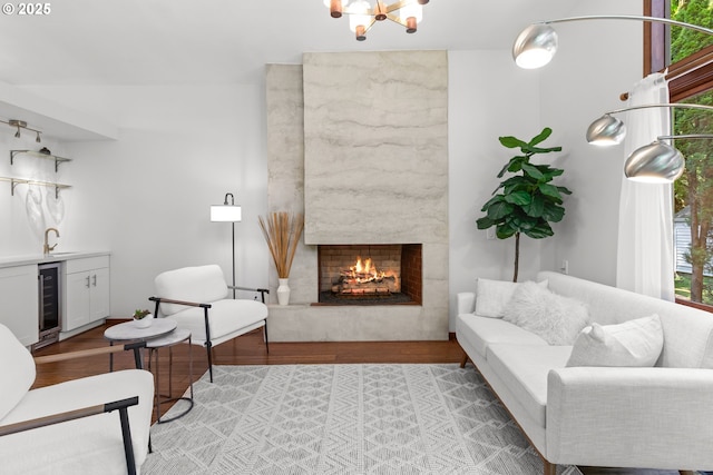 3115 NW Cornell Rd, Portland, OR 97210 - living area with wine cooler, wood finished floors, a high end fireplace, and bar area