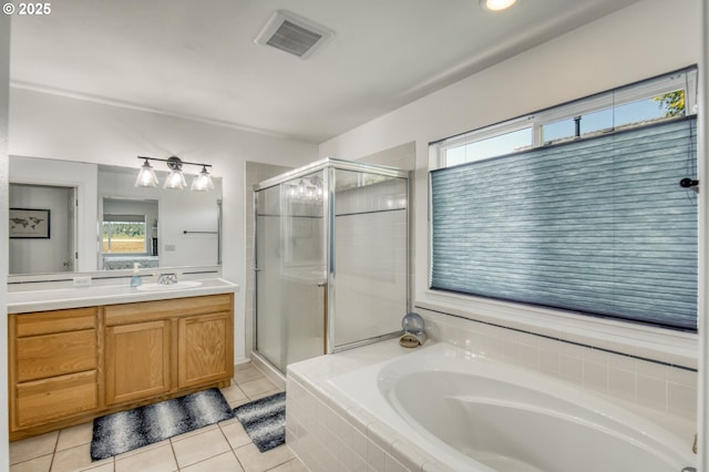 30809 NW Yorkshire St, North Plains, OR 97133 - full bathroom with a garden tub, plenty of natural light, vanity, and tile patterned floors