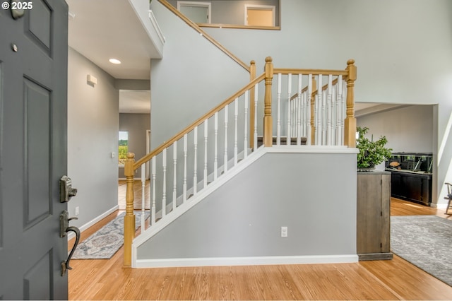 30809 NW Yorkshire St, North Plains, OR 97133 - entrance foyer with wood finished floors, baseboards, stairs, recessed lighting, and a high ceiling