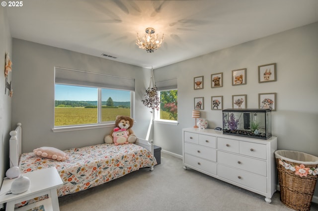 30809 NW Yorkshire St, North Plains, OR 97133 - bedroom with light carpet, a chandelier, and baseboards