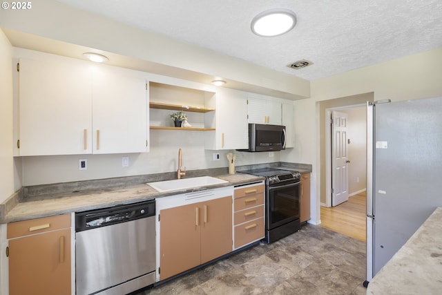 11547 NE San Rafael St, Portland, OR 97220 - kitchen with stainless steel appliances, a sink, white cabinetry, light countertops, and open shelves