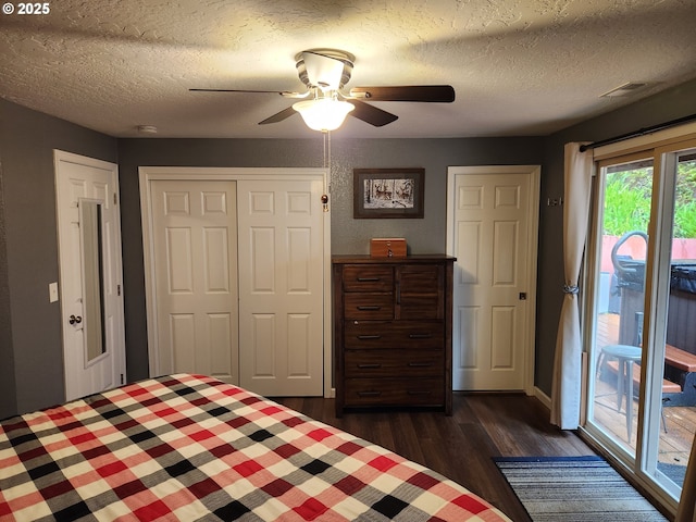 2453 Stephanie Ln, North Bend, OR 97459 - bedroom featuring dark wood-style floors, access to outside, a textured ceiling, a closet, and ceiling fan