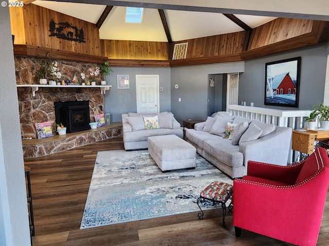 living room featuring high vaulted ceiling and wood finished floors