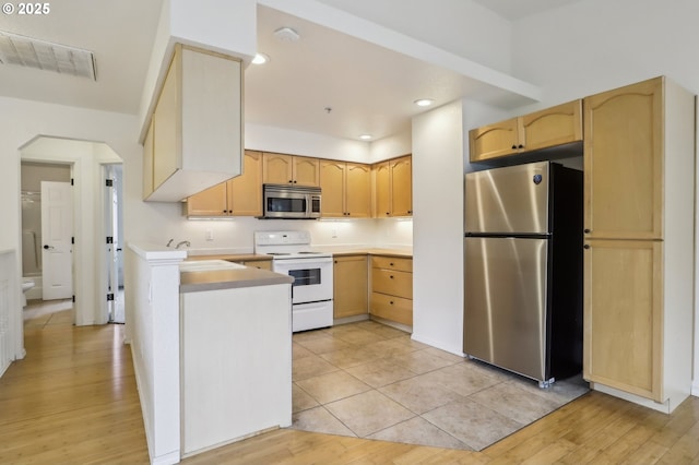 433 Harris Ln, Oregon City, OR 97045 - kitchen featuring stainless steel appliances, a sink, light brown cabinetry, and recessed lighting