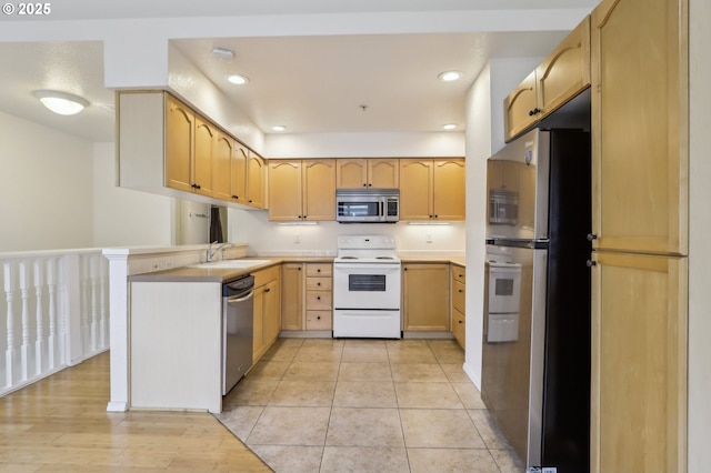 433 Harris Ln, Oregon City, OR 97045 - kitchen featuring stainless steel appliances, a sink, light brown cabinetry, a peninsula, and light countertops