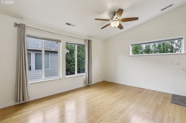 433 Harris Ln, Oregon City, OR 97045 - empty room featuring plenty of natural light, vaulted ceiling, hardwood / wood-style flooring, ceiling fan, and baseboards