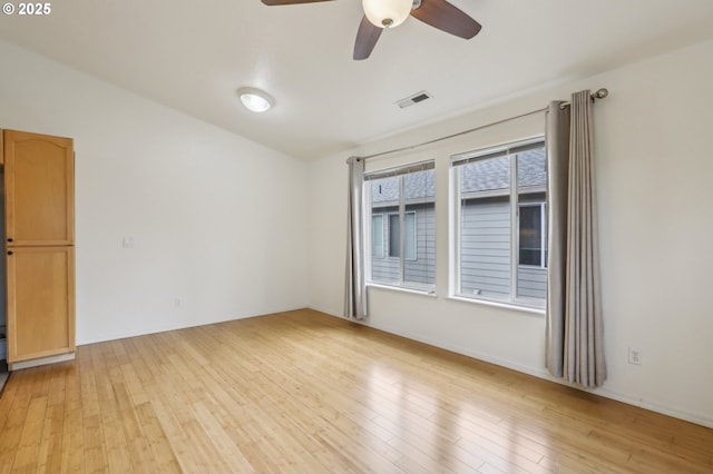 433 Harris Ln, Oregon City, OR 97045 - spare room featuring light wood-type flooring, a ceiling fan, and baseboards