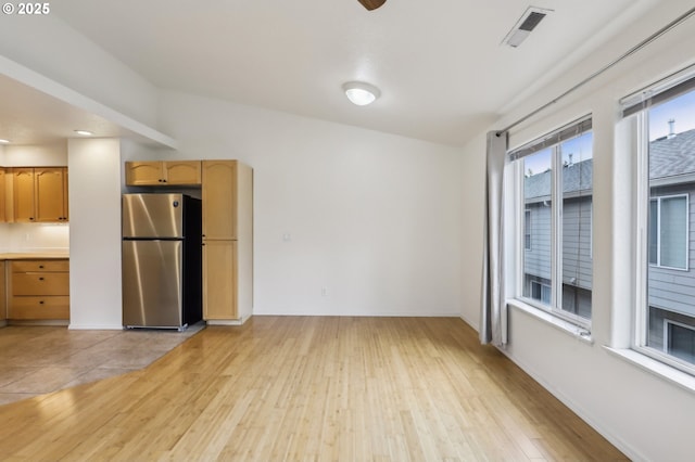 433 Harris Ln, Oregon City, OR 97045 - unfurnished living room featuring light wood-style floors and baseboards