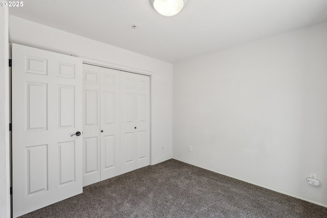 433 Harris Ln, Oregon City, OR 97045 - unfurnished bedroom with dark colored carpet and a closet