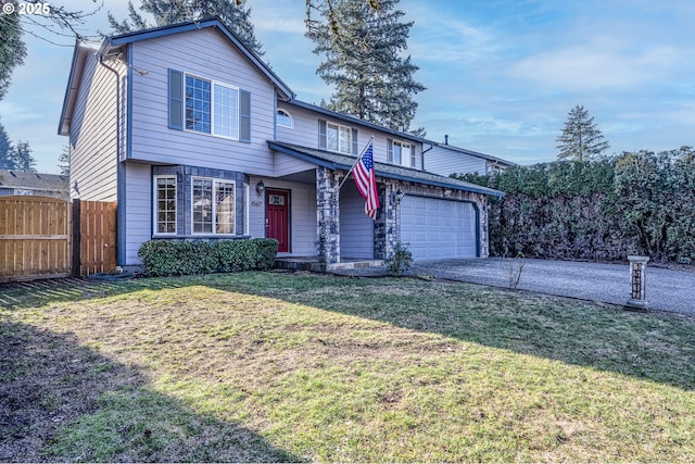 front of property featuring a garage and a front lawn